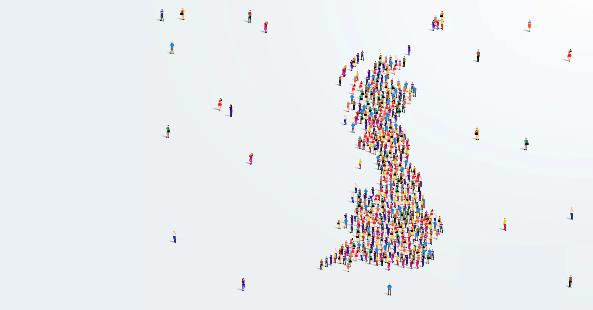 A large group of people forms the outline of the United Kingdom on a white background.